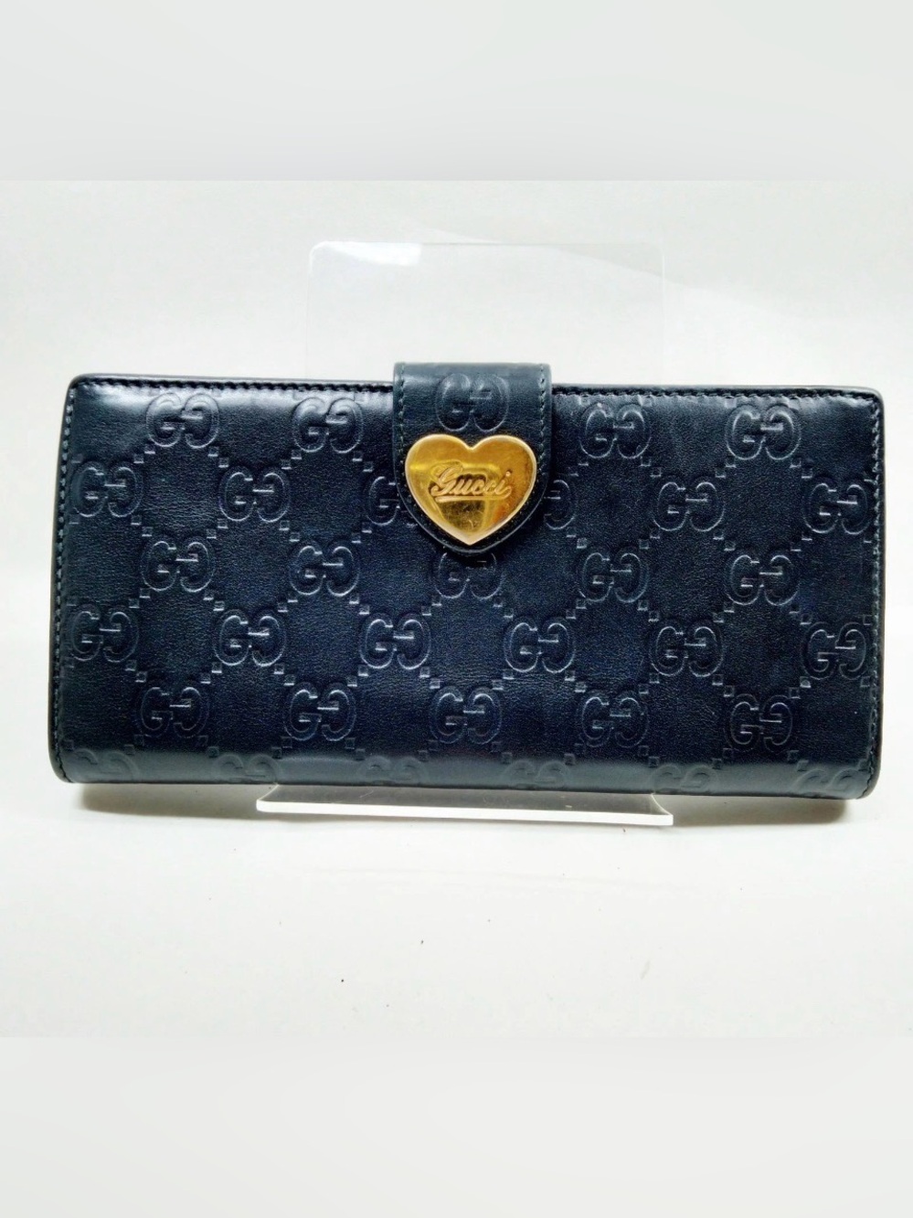 Black Gucci Guccissima leather continental wallet with heart-shaped clasp
